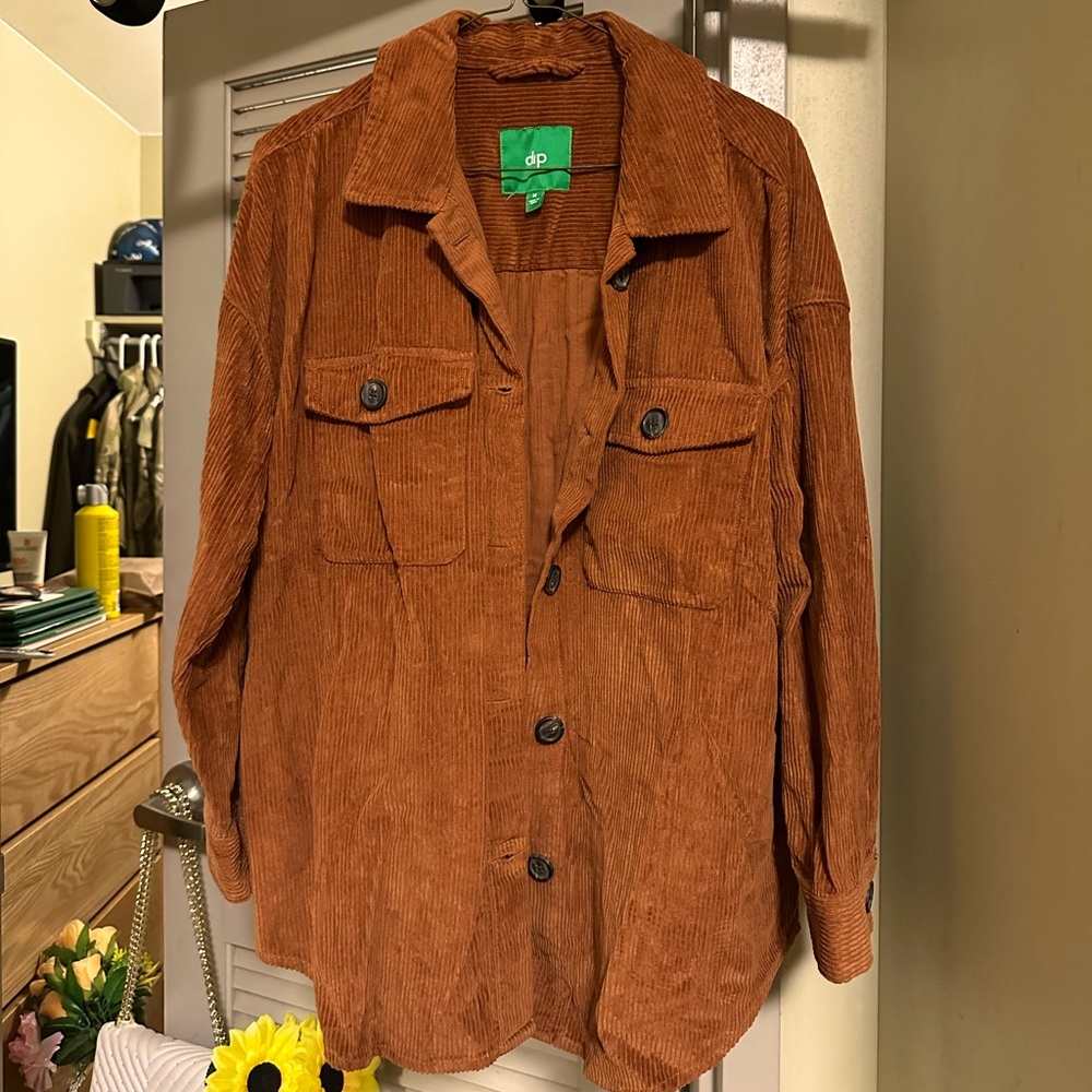 Medium button up jacket, light brown color with a hint of orange